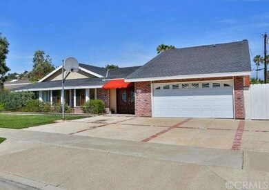The driveway is large enough for 4 cars and is bas