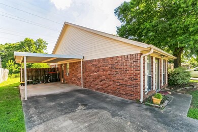 View of side of home featuring a carport