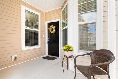 Doorway to property featuring a patio area