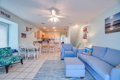 VIEW OF LIVING ROOM AND KITCHEN