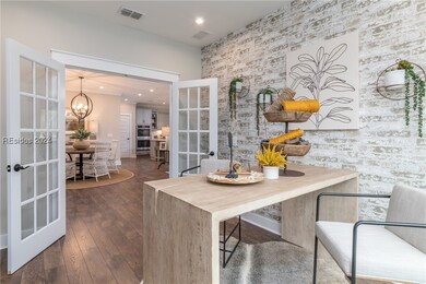 Dining space featuring french doors, dark hardwood