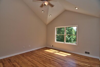 The living room is unique with a beautiful angled 