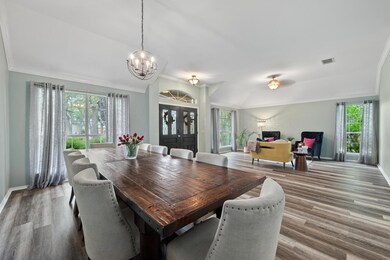 Dining room featuring wood finished floors, a cha
