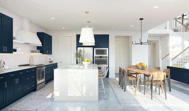 Kitchen with waterfall island and pendant lighting