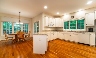 Showing off the spacious kitchen with the eat in area