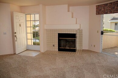 Spacious and light living room with a fireplace.