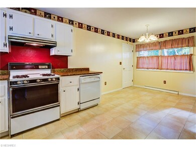 Eat-in area of kitchen. Door leads to attached gar