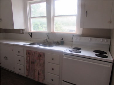 Kitchen looks out onto the large side yard.