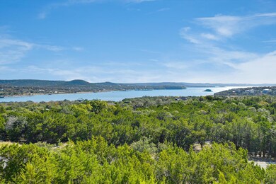 Water view with a heavily wooded area and mountai