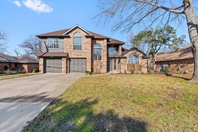 View of front of property with a garage and a fron