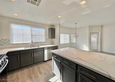 Kitchen with a sink, stainless steel appliances, v