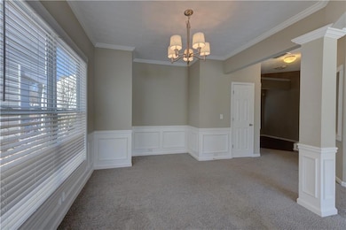 Carpeted empty room with ornamental molding, ornat