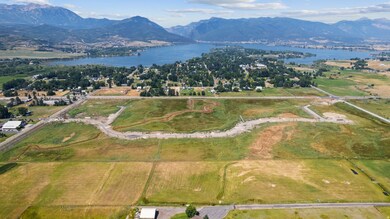Aerial view of property's location featuring a water and mountain view