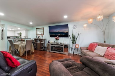Living area featuring recessed lighting and wood f