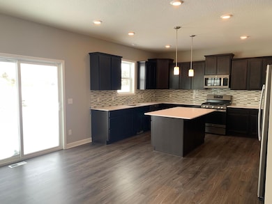 An awe-inspiring kitchen with a beautifully styled island is the perfect place for friends and family to gather around for years to come. Model photo