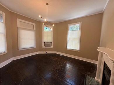 Unfurnished dining area featuring baseboards, hard