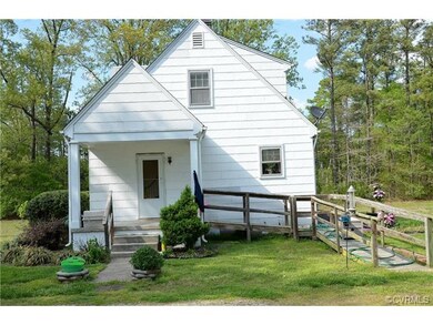 Side porch with steps and ramp for easy access.