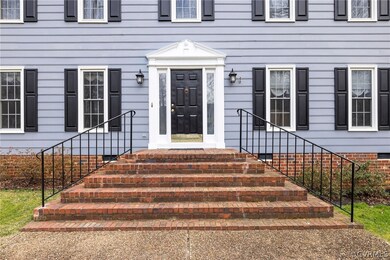 Beautiful front entrance with brick porch .