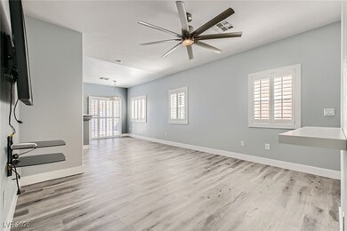 Empty room featuring light wood-type flooring, vis