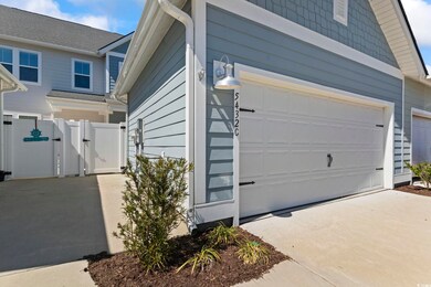 View of home's exterior with fence, driveway, and 