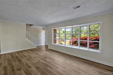 Living room and stairs to 2nd level.  Great natura