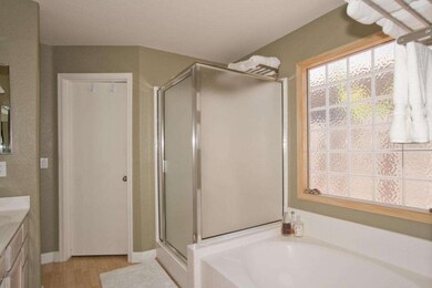 Master bath with tub and shower
