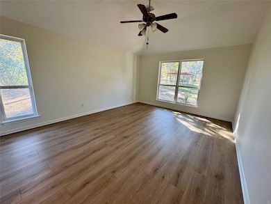 Unfurnished room featuring wood finished floors, 