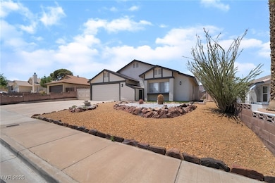 View of front of property with concrete driveway,