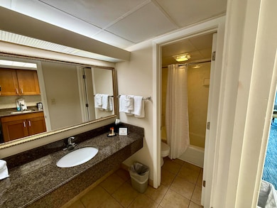 Full bathroom featuring a paneled ceiling, sink, t