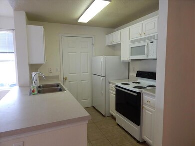 Kitchen...Refrigerator, range/oven, microwave all