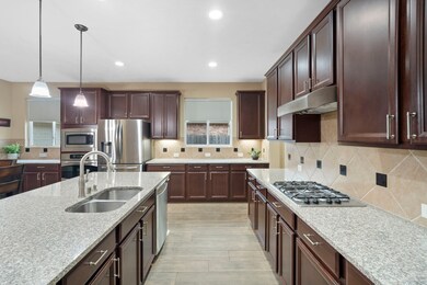 Stainless steel appliances and pendant lighting el