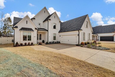 Carriage load garage and professionally landscaped