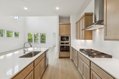 Kitchen in the Da Vinci II home plan by Trophy Signature Homes – REPRESENTATIVE PHOTO