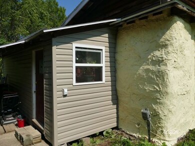 Side of house.  New vinyl siding
