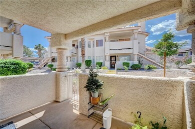 View of patio / terrace with stairs and a balcony