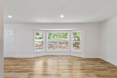Unfurnished room featuring baseboards, recessed li