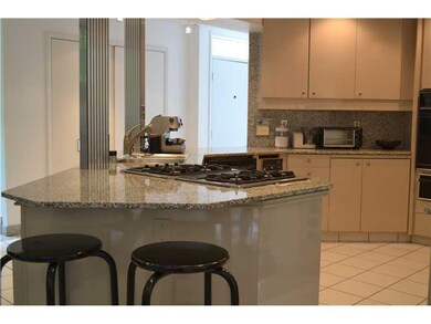 Kitchen. Granite counterops, counter seating and a
