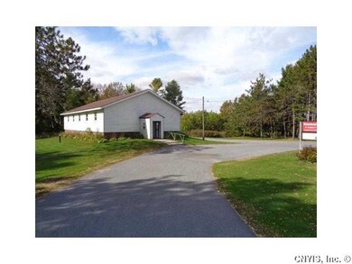 Exterior Front Church building with lighted parkin