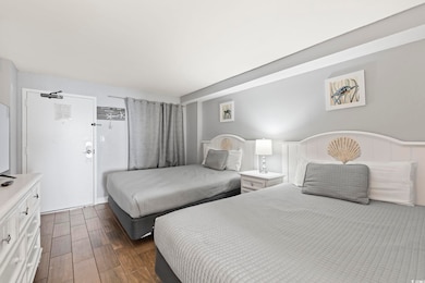 Bedroom featuring dark wood finished floors
