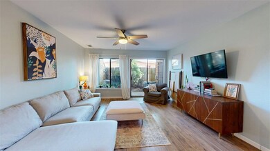 Living area featuring baseboards, visible vents, l