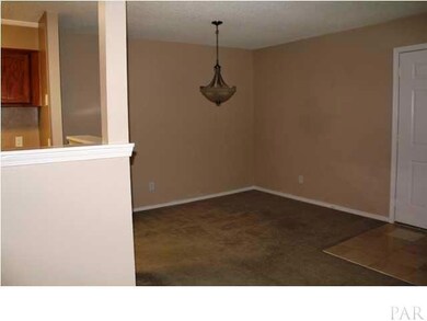 The dining room adjoins both kitchen and living room