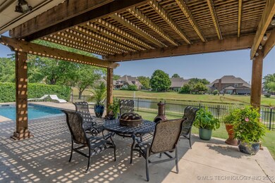With Pergola and large patio and a view of the pon