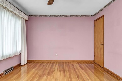 Family room has coat closet and ceiling fan.