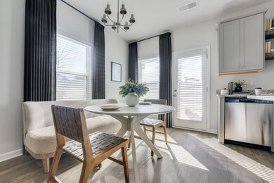 Dining room featuring baseboards, a chandelier, an
