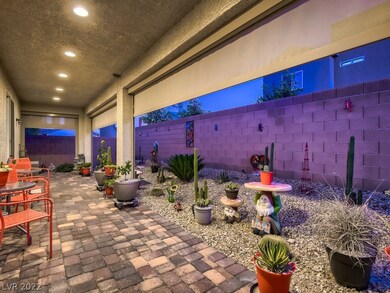 SUPER CUTE BACKYARD PATIO WITH COLORED PAVERS AND