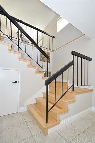 The Entry features Porcelain Tile Floors and a new