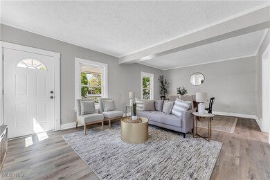 Living room featuring light hardwood / wood-style flooring and a textured ceiling