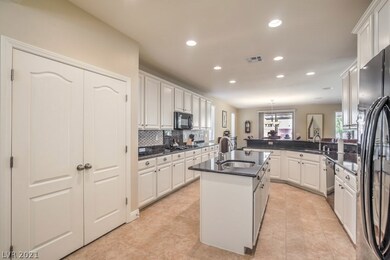 Kitchen pantry / Tiled Backsplash / Black applianc