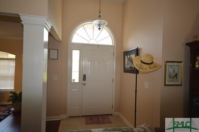 Open foyer with decorative lighting.