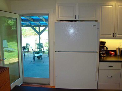Kitchen. Door opens to patio and private backyard.